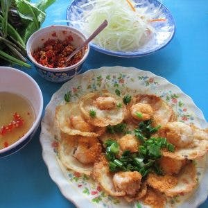 Eating bánh khọt in Vung Tau, Vietnam